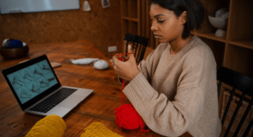 Person learning a creative skill through an online course on a laptop